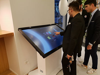 Milan-Kiosk-2 Woman Using Interactive Table