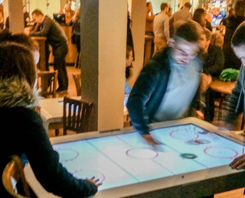 People interacting with the tables