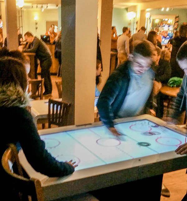 People interacting with the tables